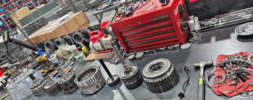 Parts used to assemble a remanufactured transmission in a factory.